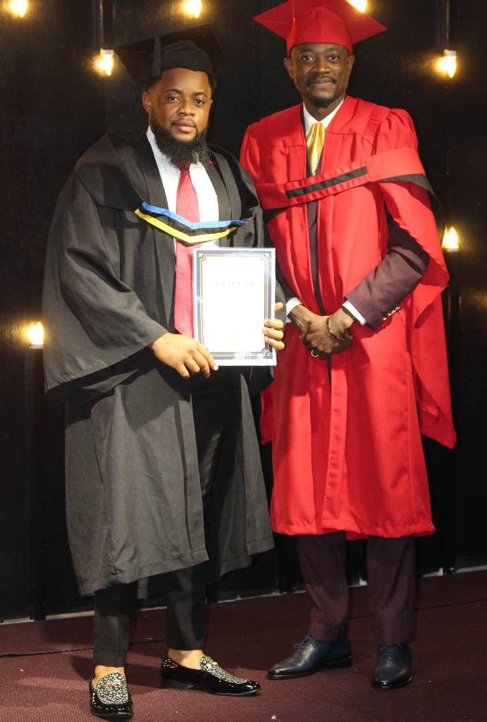 An IASP graduate receiving a certificate from the presiding prophet